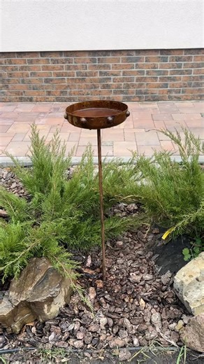 A rustic metal bird bath adds a graceful decorative accent to garden compositions and landscapes, creating an atmosphere of warmth, romance, and quiet coziness. This rusty metal garden art can be used as décor at your home, in your garden, backyard, terrace, or at the entrance to your house. Crafted from natural metal and finished with an authentic rust patina, it is designed for year-round outdoor use and easily withstands rain, direct sunlight, and changing weather conditions. An ideal gift fo