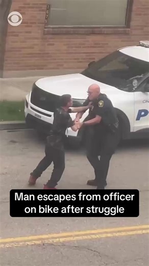 A man escaped police custody after a short struggle with an officer in Cincinnati, Ohio. Video shows an officer trying to restrain a man and use a taser as they run in a circle before the man eventually fled on a bike.