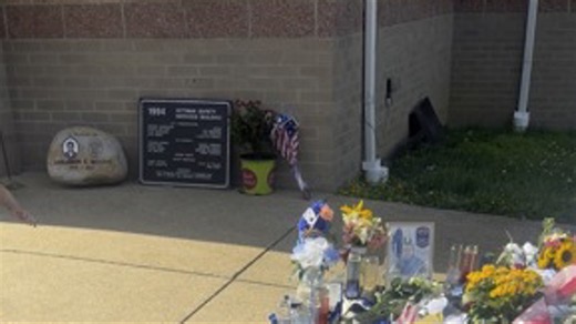 Memorial continues to grow at Rittman police station
