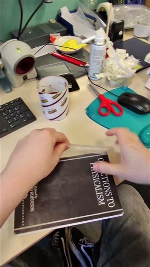 Librarian Power! Taking off a plastic cover in one pull!