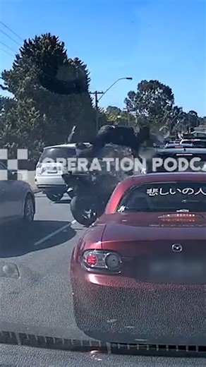 The shocking moment a motorcyclist crashed into stopped traffic and was sent flying from his bike has been caught on camera. | News.com.au