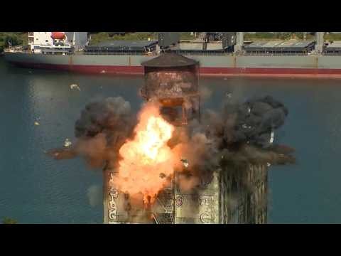 Watch the explosive demolition of a rooftop water tower in Portland