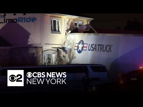 Crews trying to figure out how to get semi-truck out of building after crash