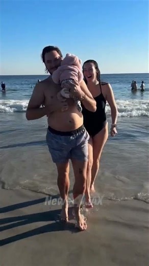 6-week-old baby dips her toes in water for Polar Plunge at Jacksonville Beach