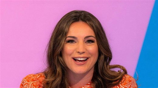 Kelly Brook looks ready for this weekend's warmer weather in zesty orange and white dress