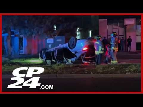 Four passengers uninjured after vehicle hits curb and flips over in North York