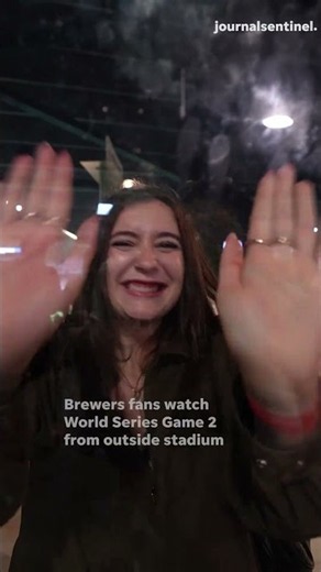 Fans try to see World Series from American Family Field windows