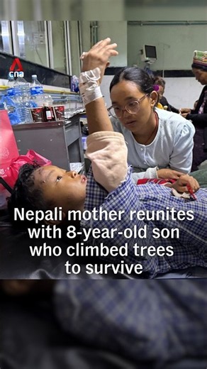 Nepali mother reunites with 8-year-old son who climbed trees to survive