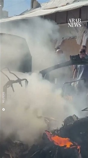 Palestinians inspect site of Israeli strike on vehicle in Gaza City