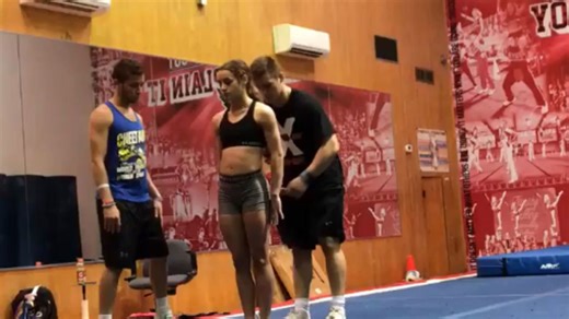 College cheerleader tries to learn a new stunt but it goes wrong