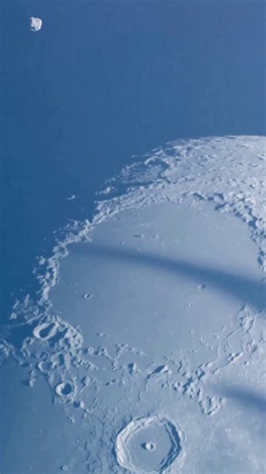 While observing the Moon in daylight, a telescope recorded an unusual object approaching the lunar surface before a brief flash-like event was seen.The exact nature of the object and the event cannot be confirmed from a single observation. Possible explanations include a meteoroid, a satellite transit, or another transient phenomenon. Events like these highlight the challenges and excitement of lunar observation.A rare daytime sighting... captured against the bright lunar surface.