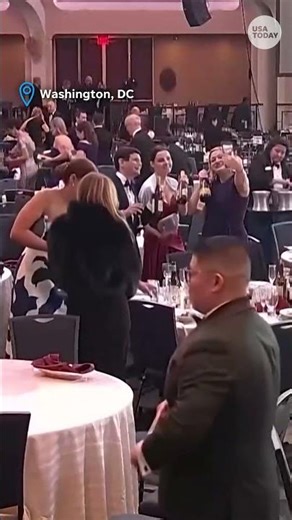 See guests grab wine bottles after White House Correspondents’ Dinner shooting