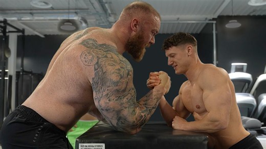 Bodybuilder tries arm wrestling the strongest man in the world
