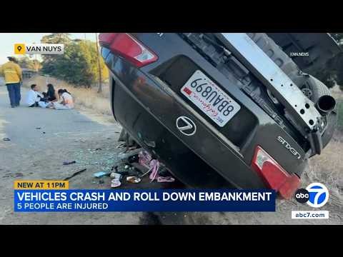 5 people hurt after 2 vehicles crash and roll 200 feet down 405 Fwy embankment
