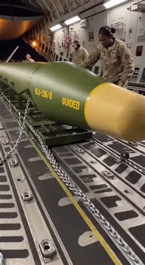 This hyper-realistic CGI sequence captures the intense process of loading a Massive Ordnance Air Blast (MOAB) bomb into a C-130 Hercules cargo aircraft. Chains groan under tension as the 21,000-pound weapon glides along rails into the dimly lit bay, while technicians double-check clearances for a precision strike mission. Designed for maximum blast radius and psychological impact, the MOAB remains a symbol of overwhelming conventional force—and logistical might. #MOAB #C130Hercules #Conventional