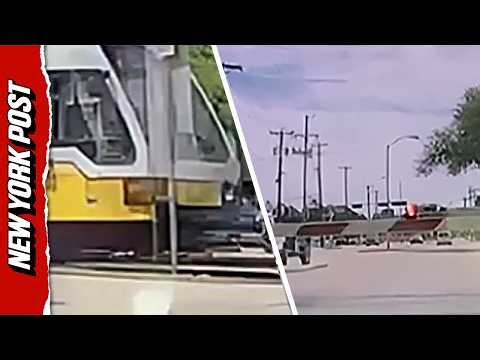 Self Driving Tesla Crashes Through Barrier Moments Before Oncoming Train