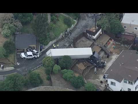 LIVE: Big rig loses control, crashes through fence, nearly hits home in Crockett