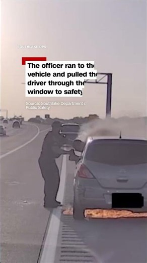 Police officer pulls driver from burning car