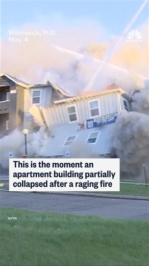 This is the moment an apartment building partially collapsed after a raging fire