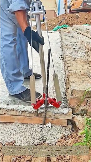 Rebar Extraction: Custom Hand Tool Pulls Embedded Steel Rod Out Of Wet Concrete