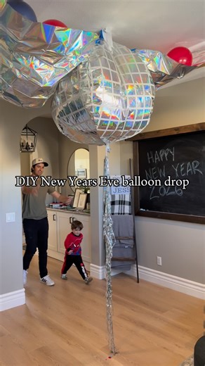 This year we skipped the crowds and brought the New Year’s Eve ball drop home with a DIY balloon drop for kids. I used a plastic tablecloth, a 36 inch silver balloon to recreate the Times Square ball drop, plus regular balloons and confetti to make an easy balloon drop at home. It was super simple to make and so fun to watch my son’s reaction when he pulled the string. The perfect way to celebrate New Year’s Eve as a family without staying out late. If you’re looking for a family friendly New Ye