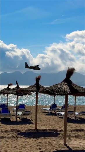 Firefighting Plane Drops Water Over Pollença Bay in Mallorca