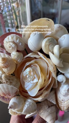 Honestly I’m considering proposing to my partner purely so I can carry this down the aisle 😭 This handcrafted seashell bouquet is exquisitely designed for the ultimate beach bride experience Carry a piece of the ocean down the aisle with you on your big day These are for the brides who want to be unique, to have a luxury wedding experience, and who want very photographable accessories, and who want their “something new” to maybe someday be their daughters “something old” This and other bouquets