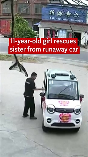 Watch the moment an 11-year-old girl in China miraculously saved her younger sister from a runaway vehicle. CCTV footage shows an electric cabin scooter gaining speed as it drives into a nearby restaurant. Smashing through the entrance, the runaway vehicle heads straight towards the toddler, who is saved by her sister who runs towards the child and pulls her out of the way with less than a second to spare. The driver in Henan town apologised and paid the restaurant for any damages. Originally pu
