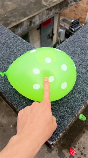 Experiment: Will a water balloon explode if it rolls down a tall building? 💥🎈 #balloon