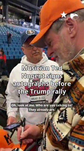 Musician Ted Nugent signs autographs before the Trump rally