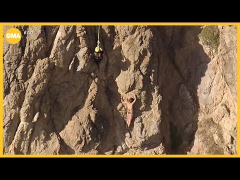Rescue of woman clinging to cliff caught on camera