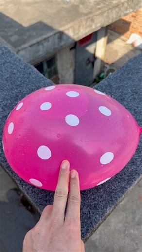 Experiment: Will a water balloon explode if it rolls down a tall building? 💥🎈 #satisfying #shorts