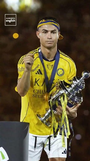 Ronaldo Raises Al-Nassr Trophy.mp4
