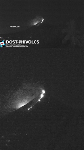 Meteor lights up sky above erupting volcano