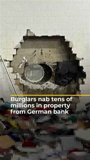 Footage shows a massive hole in the vault of Sparkasse Bank in Gelsenkirchen, Germany, where thieves made off with valuables estimated to be worth between 10 and 90 million euros ($11.7 to 105.7 million), police said. Angry customers assembled outside the bank on Tuesday demanding answers. | Al Jazeera English
