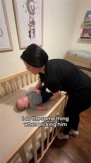 The right way to lift a baby out of a crib