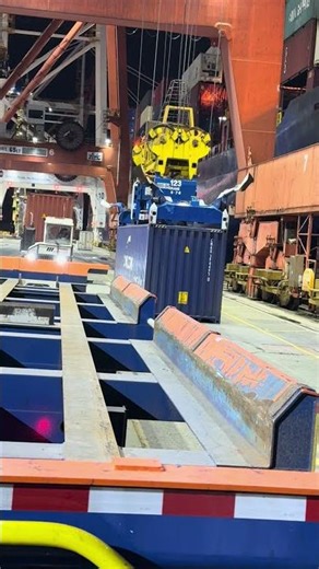 Dock gantry picking up and loading container to the shipping vessel #docks #container #vancouver