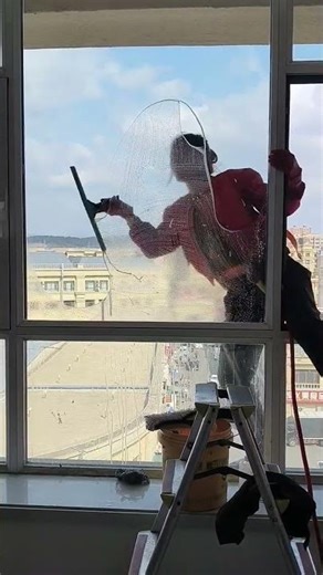 😅 High-rise window cleaning, ain't no joke! You think they're crazy or just super skilled?#cleaning