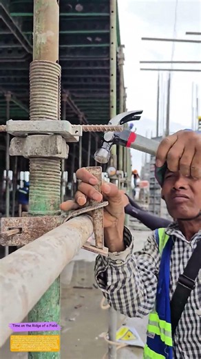 Securing Steel Frames: The Worker’s Hammer-and-Nail Precision