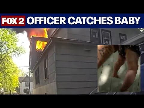 Officer catches baby thrown from burning home in Michigan