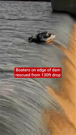 This is the moment four men were rescued from boat at it teetered precariously on the edge of a 130ft drop off the side of a dam. National Sea Rescue Institute (NRSI) crews were dispatched to the Grootdraai Dam in Mpumalanga, South Africa, on Monday (29 December) after the boat suffered motor failure and drifted toward the edge of the spillway as millions of gallons of water thundered over the side of the dam wall.
