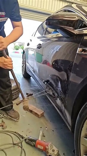 Repair process of a dented car door sheet metal