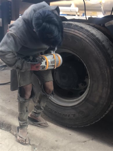 Changing a Truck Tire: A Mechanic's Skill