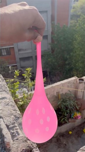 Experiment: Will a water balloon explode when it rolls down from a tall building?💥🎈#satisfying