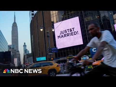 'Just Married' message appears on MSG video screen during reporter's live shot