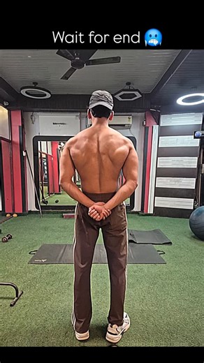 ☝️Mohammad Kaif ☝️ on Instagram: "Ai prompt image generator 👇 . . . A hyper-realistic back view of a muscular man in a gym, his skin is mutated with organic alien-like exoskeleton features. Sharp bone spikes are protruding from his shoulders and traps. A prominent ribbed spinal column is visible under the skin, extending into vein-like patterns across the back and arms. He is wearing a black cap and track pants. The background is a gritty indoor gym with green turf, mirrors, and workout equipme