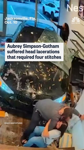 Couple survives car crashing into hair salon