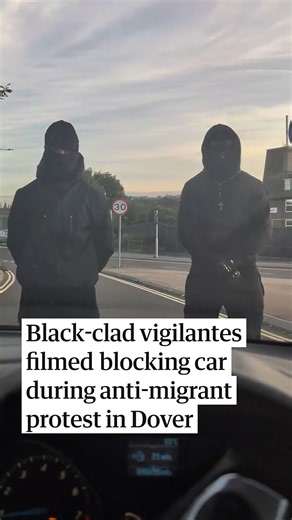 Black-clad vigilantes filmed blocking cars during anti-migrant protest in Dover