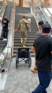 Heroic soldier carries disabled woman upstairs ❤️