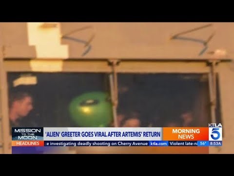 Green alien greets Artemis II astronauts